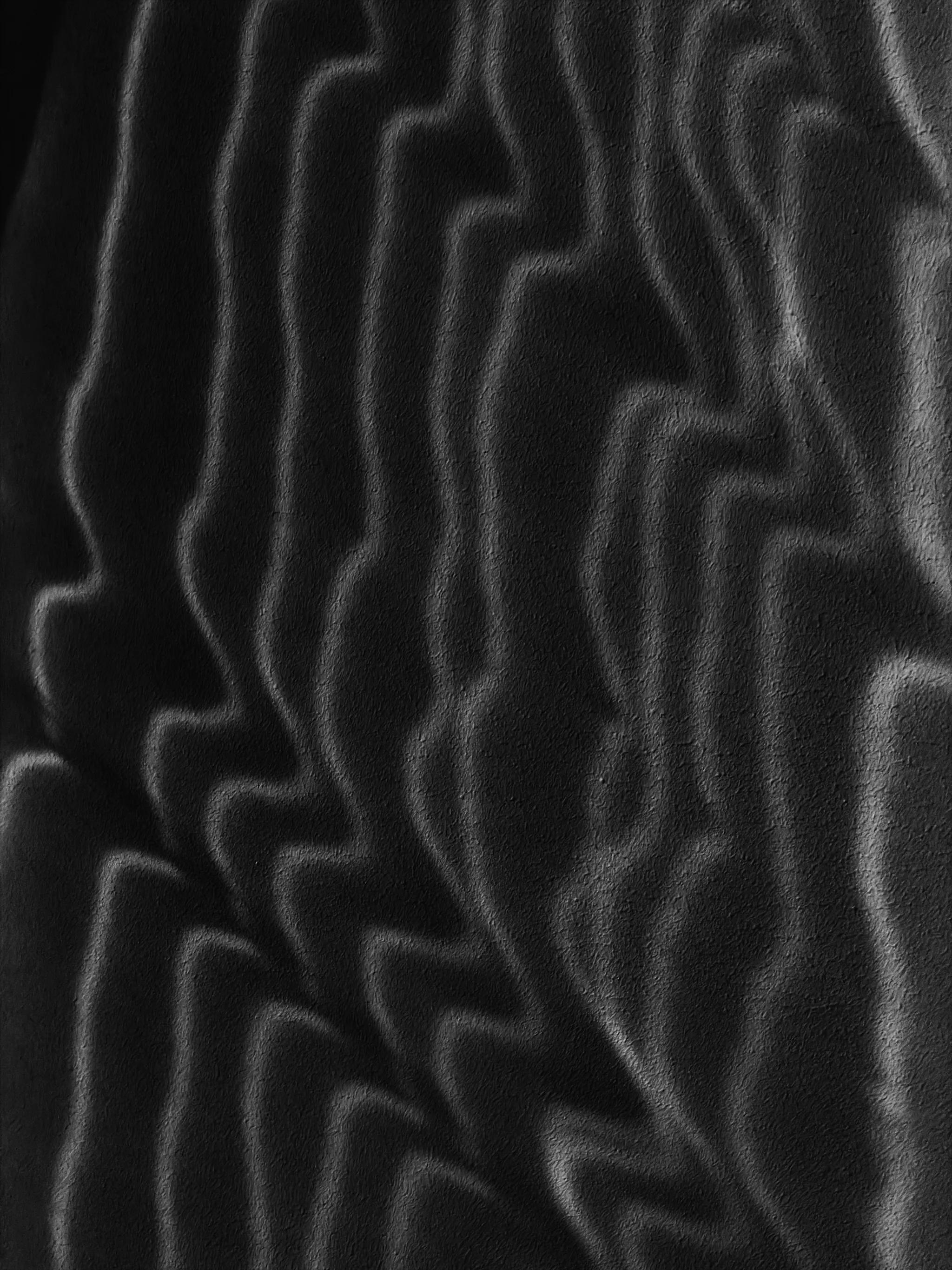 Thin, jagged ribbons of pale light ripple across a dark, rough-textured wall, their wavy stripes overlapping in a stark black-and-white abstract pattern.